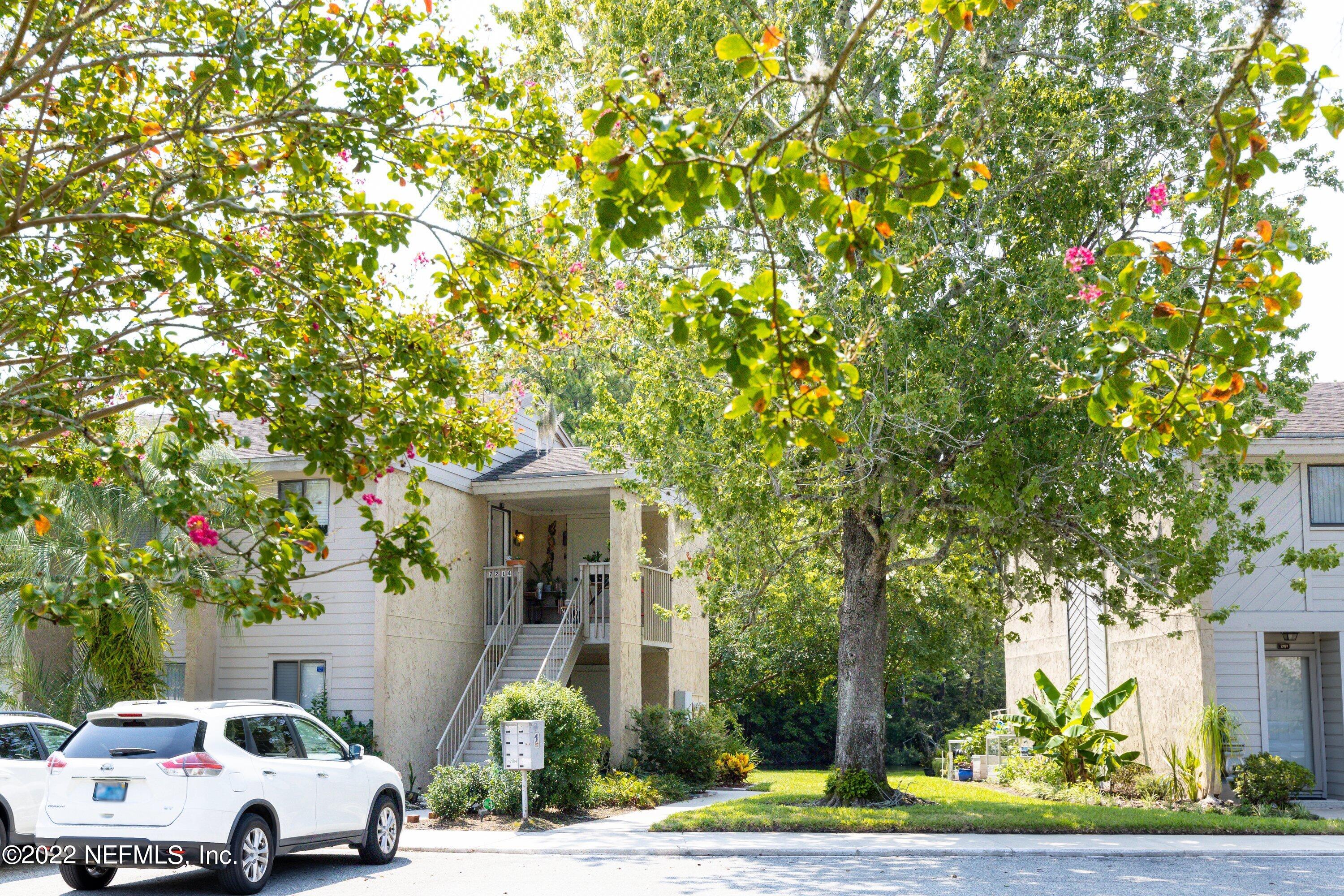 3801 Crown Point Road, Unit 2214 Jacksonville, FL 32257 - Photo 5 of 27 a car parked in front of a white house
