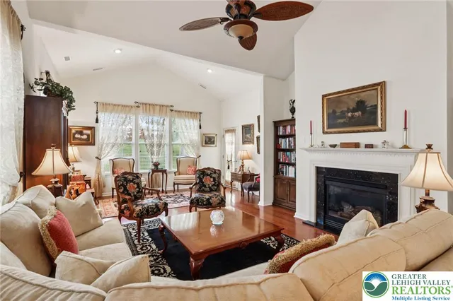a living room with furniture a rug and a window