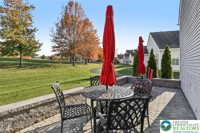 a view of a grassy field with an trees