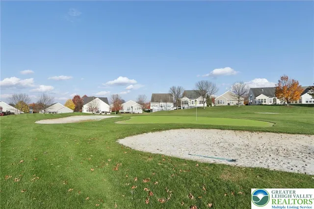 a outdoor living space with patio furniture and a fireplace