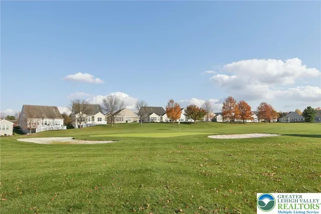 a living room with lots of furniture and a table