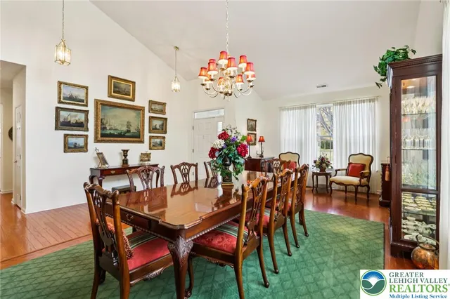 a kitchen with stainless steel appliances granite countertop sink refrigerator and cabinets