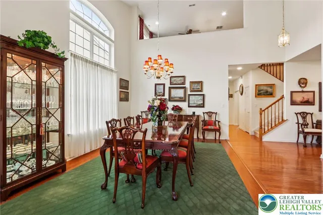 a kitchen with stainless steel appliances granite countertop a sink refrigerator and cabinets