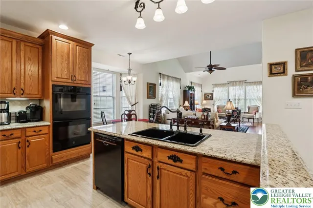 a living room with furniture fireplace and window
