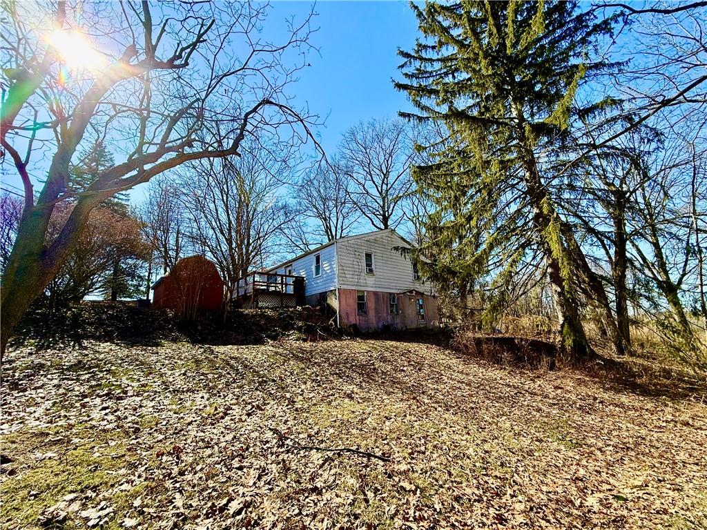 701 Chicora Road Chicora, PA 16025 - Photo 5 of 15 a house that has a tree in front of it