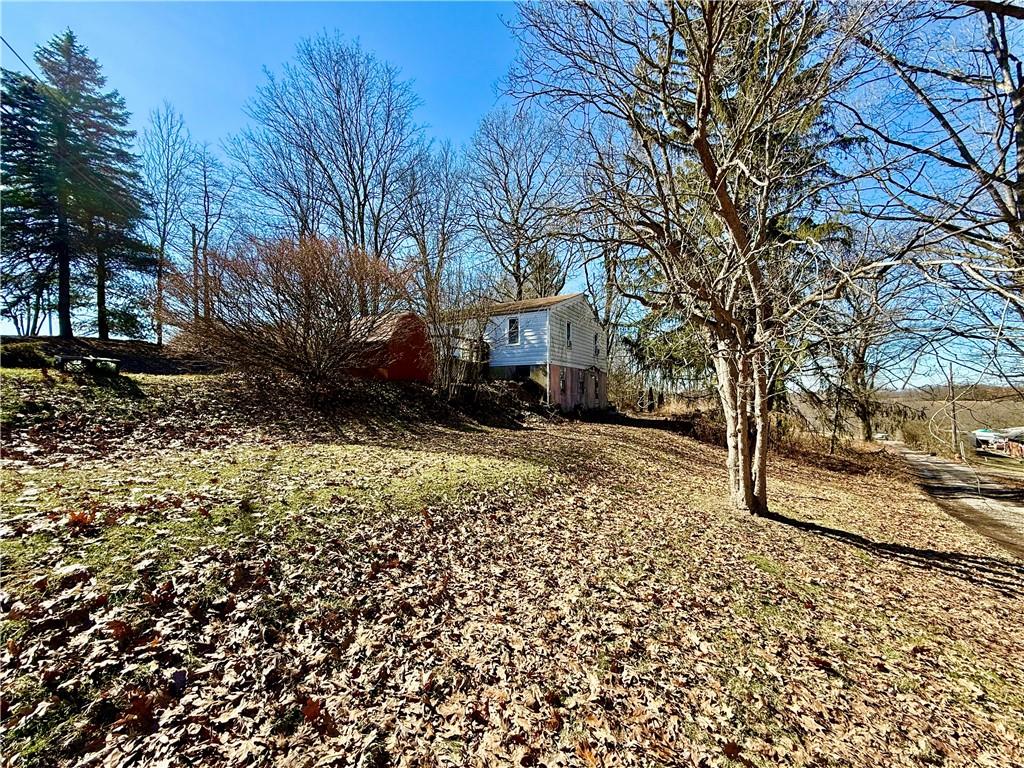 701 Chicora Road Chicora, PA 16025 - Photo 6 of 15 a view of a house with a yard