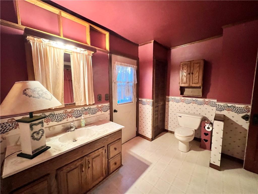3738 Ellwood Road New Castle, PA 16101 - Photo 14 of 27 a bathroom with a sink and a mirror