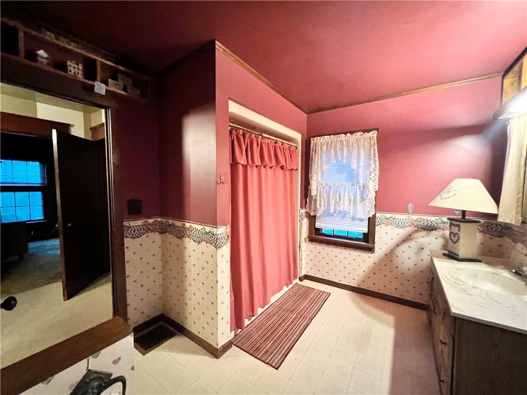 3738 Ellwood Road New Castle, PA 16101 - Photo 15 of 27 a bedroom with furniture and a window