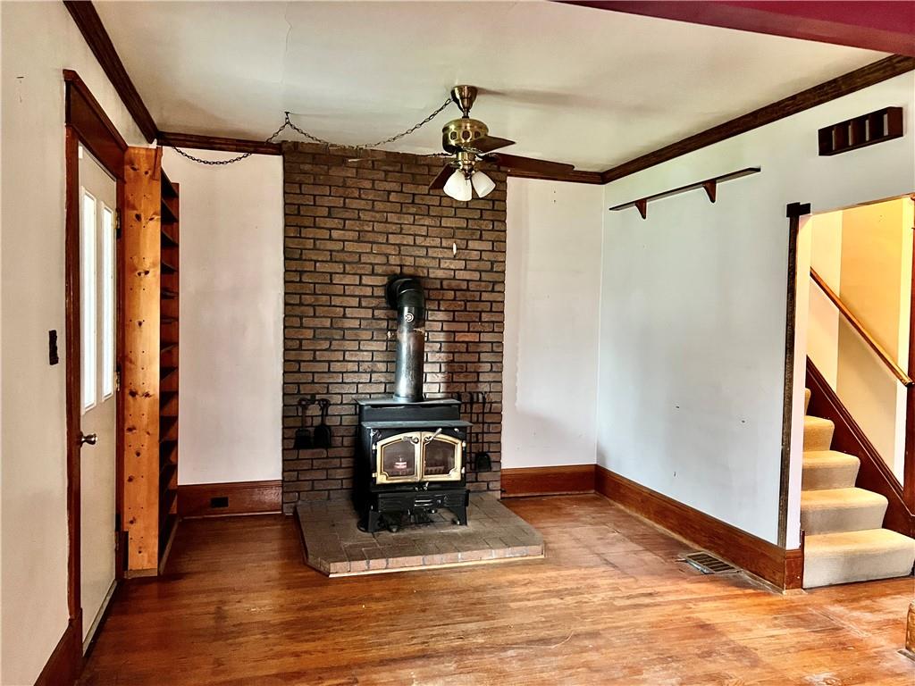 3738 Ellwood Road New Castle, PA 16101 - Photo 5 of 27 a view of a hallway with wooden floor and staircase