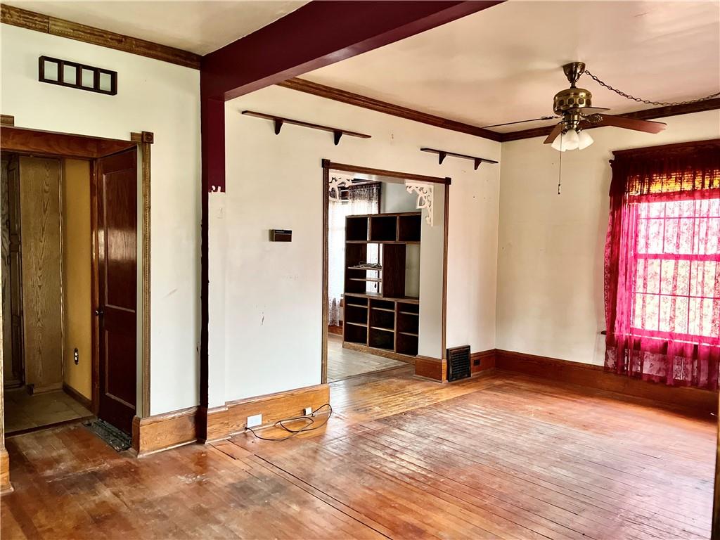 3738 Ellwood Road New Castle, PA 16101 - Photo 6 of 27 an empty room with wooden floor and windows