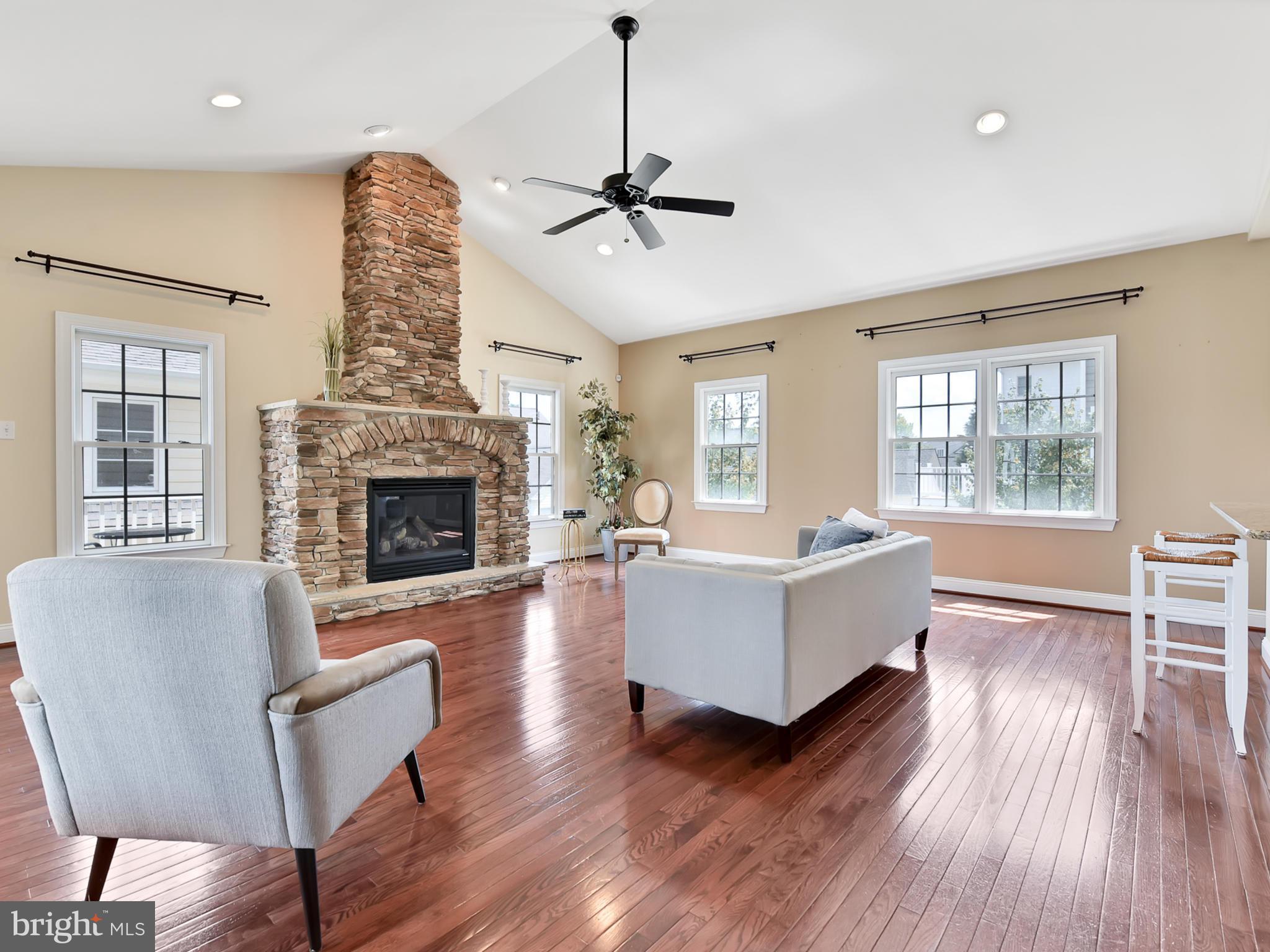 3931 Addison Woods Road Frederick, MD 21704 - Photo 10 of 65 Large family room with a beautiful stone fireplace