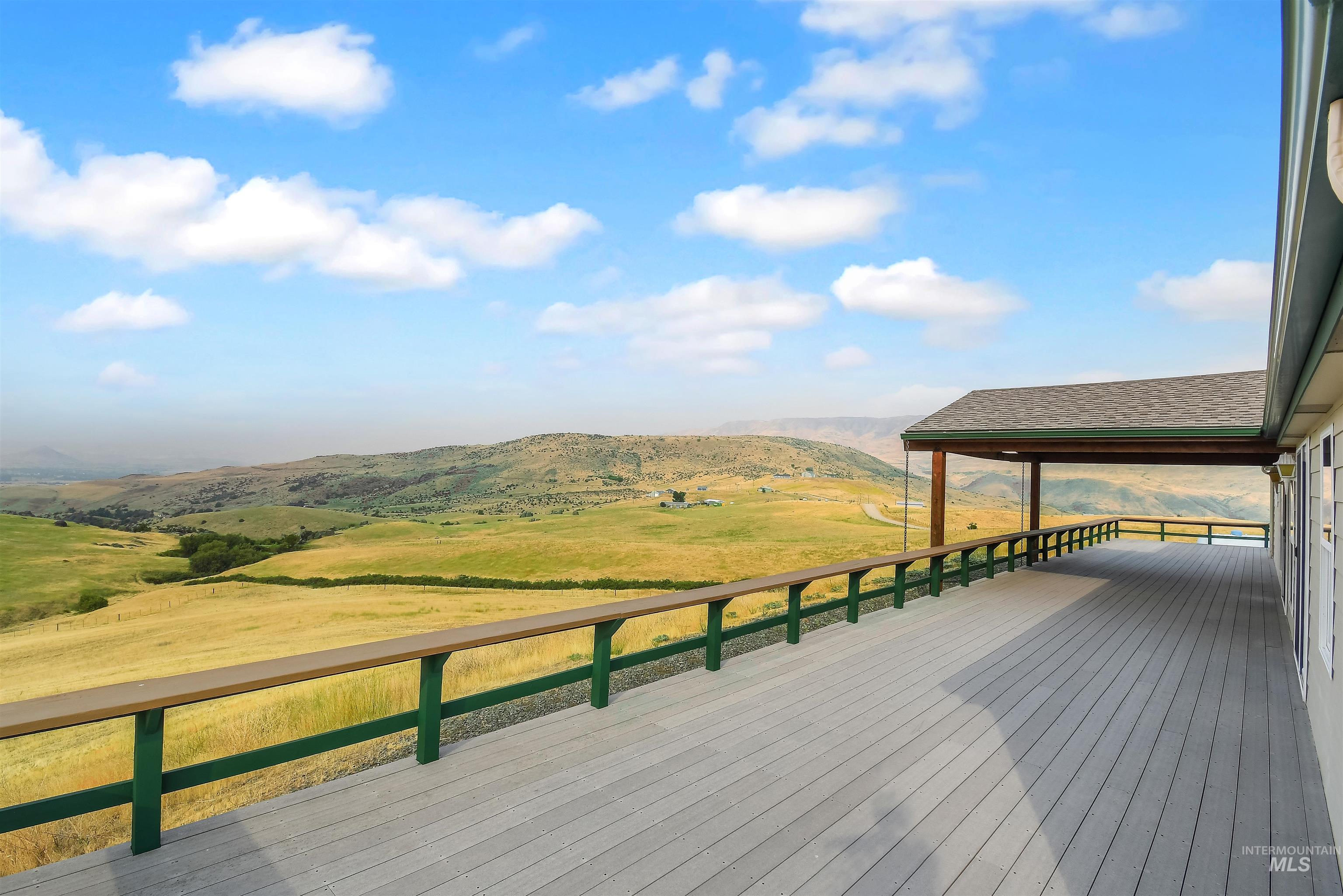 11375 Timber Butte Road Sweet, ID 83670 - Photo 37 of 49 Expansive outdoor deck featuring composite decking and a covered patio area