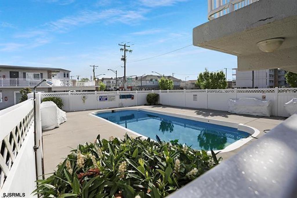 900 Wesley Avenue, Unit 103 Ocean City, NJ 08226 - Photo 12 of 15 a view of a swimming pool and a terrace