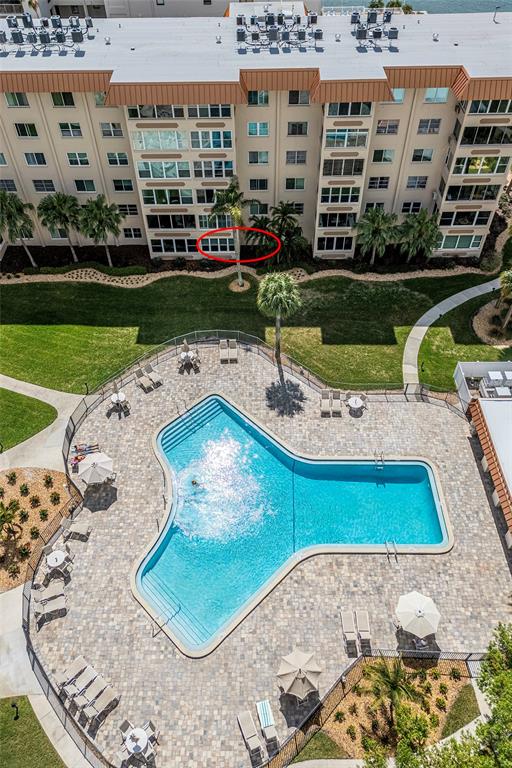 620 Edgewater Drive, Unit 103 Dunedin, FL 34698 - Photo 20 of 26 a view of a swimming pool with a patio