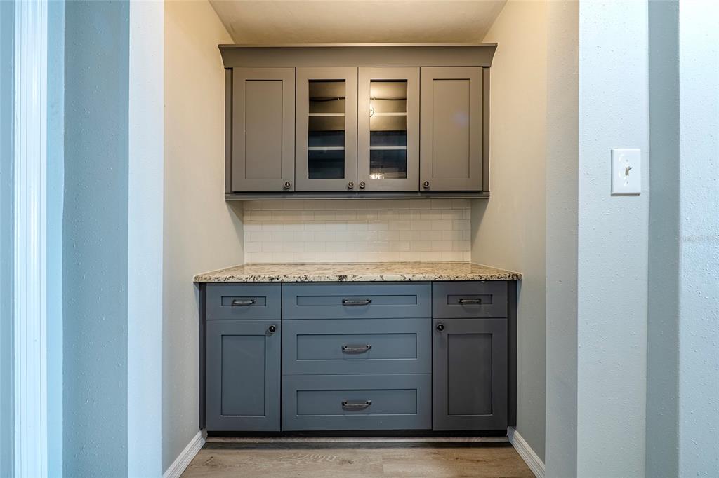 620 Edgewater Drive, Unit 103 Dunedin, FL 34698 - Photo 7 of 26 a view of an entryway with kitchen