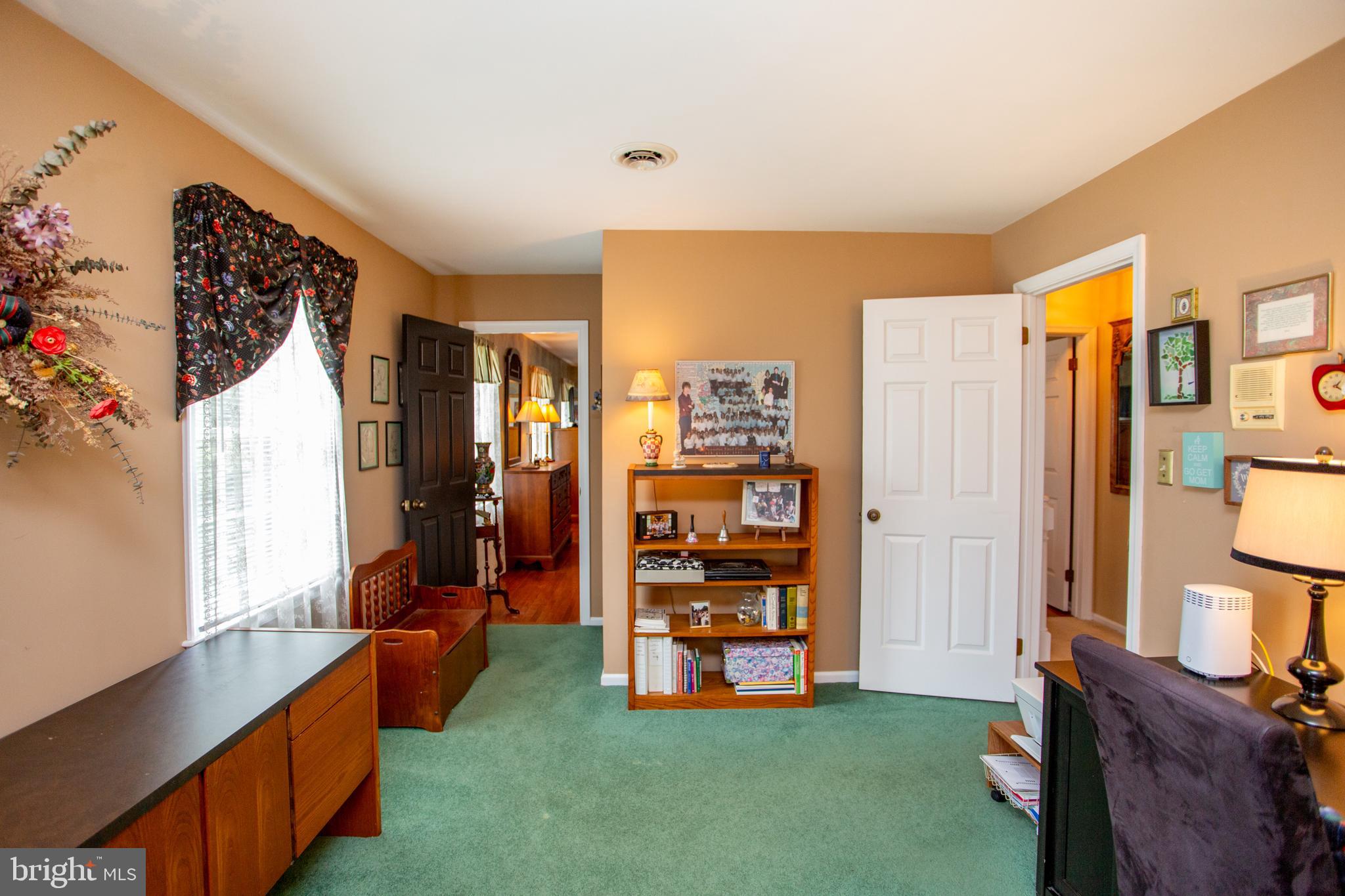950 Camelot Road Furlong, PA 18925 - Photo 48 of 106 a living room with furniture and a flat screen tv