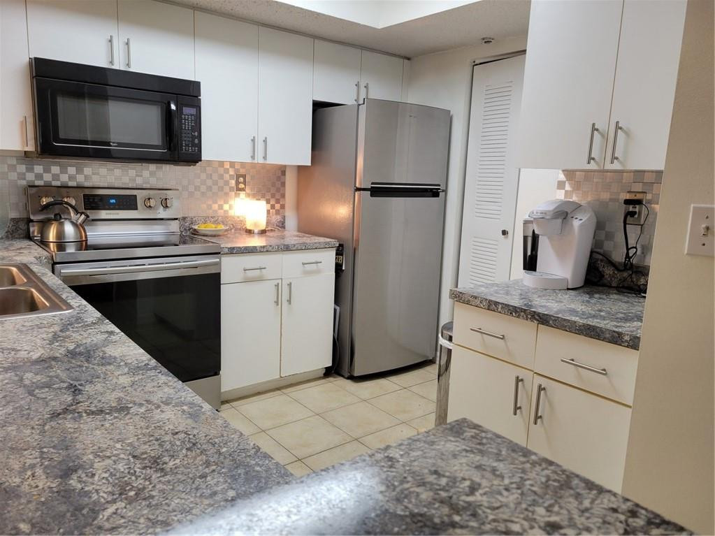 3854 Lyons Road, Unit 106 Coconut Creek, FL 33073 - Photo 10 of 21 PLENTY OF STORAGE SPACE & CABINETS