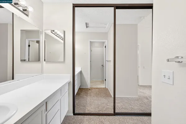 a bathroom with a glass shower door