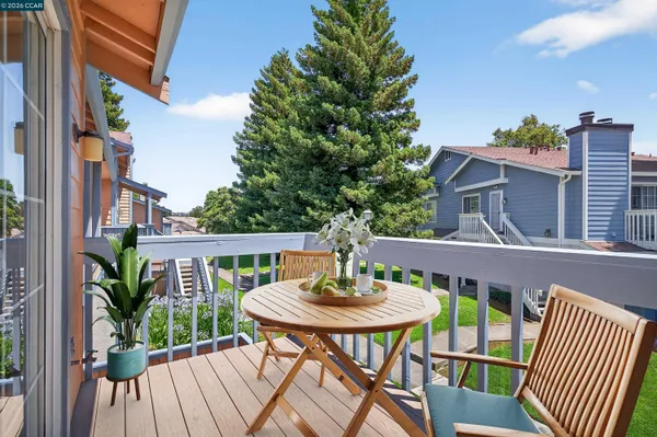 a view of balcony with wooden floor