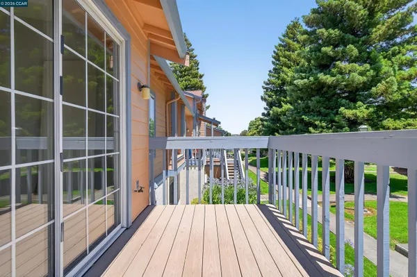 a view of a balcony with wooden floor