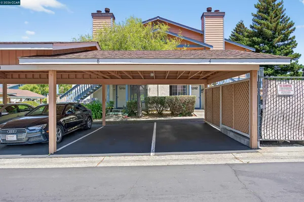 a view of house with swimming pool outdoor seating