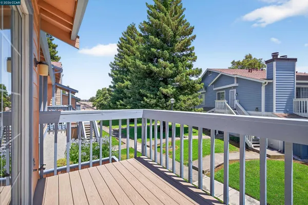 a view of balcony with wooden floor