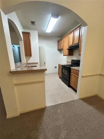 a bathroom with a granite countertop sink and mirror