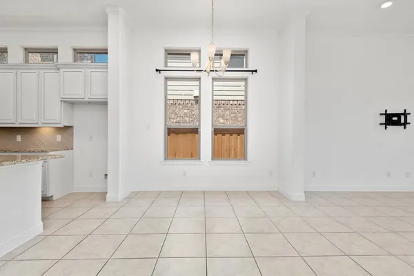 a view of kitchen with granite countertop cabinets