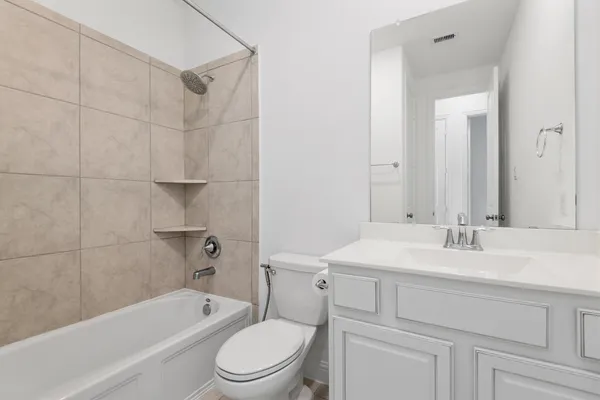 a bathroom with a sink a toilet and bathtub