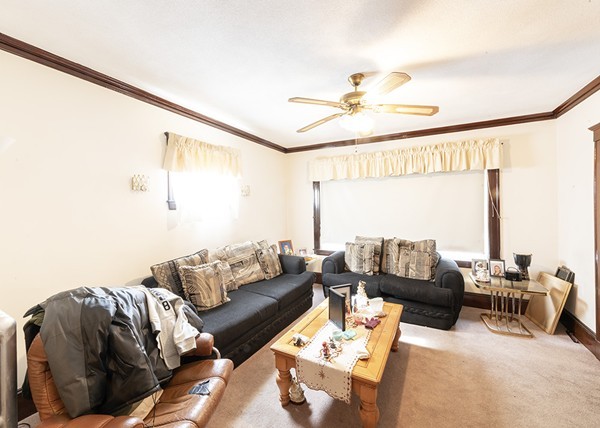 223 Ferry Street Everett, MA 02149 - Photo 15 of 24 a living room with furniture and a large window