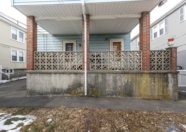 223 Ferry Street Everett, MA 02149 - Photo 20 of 24 a front view of a house with a yard
