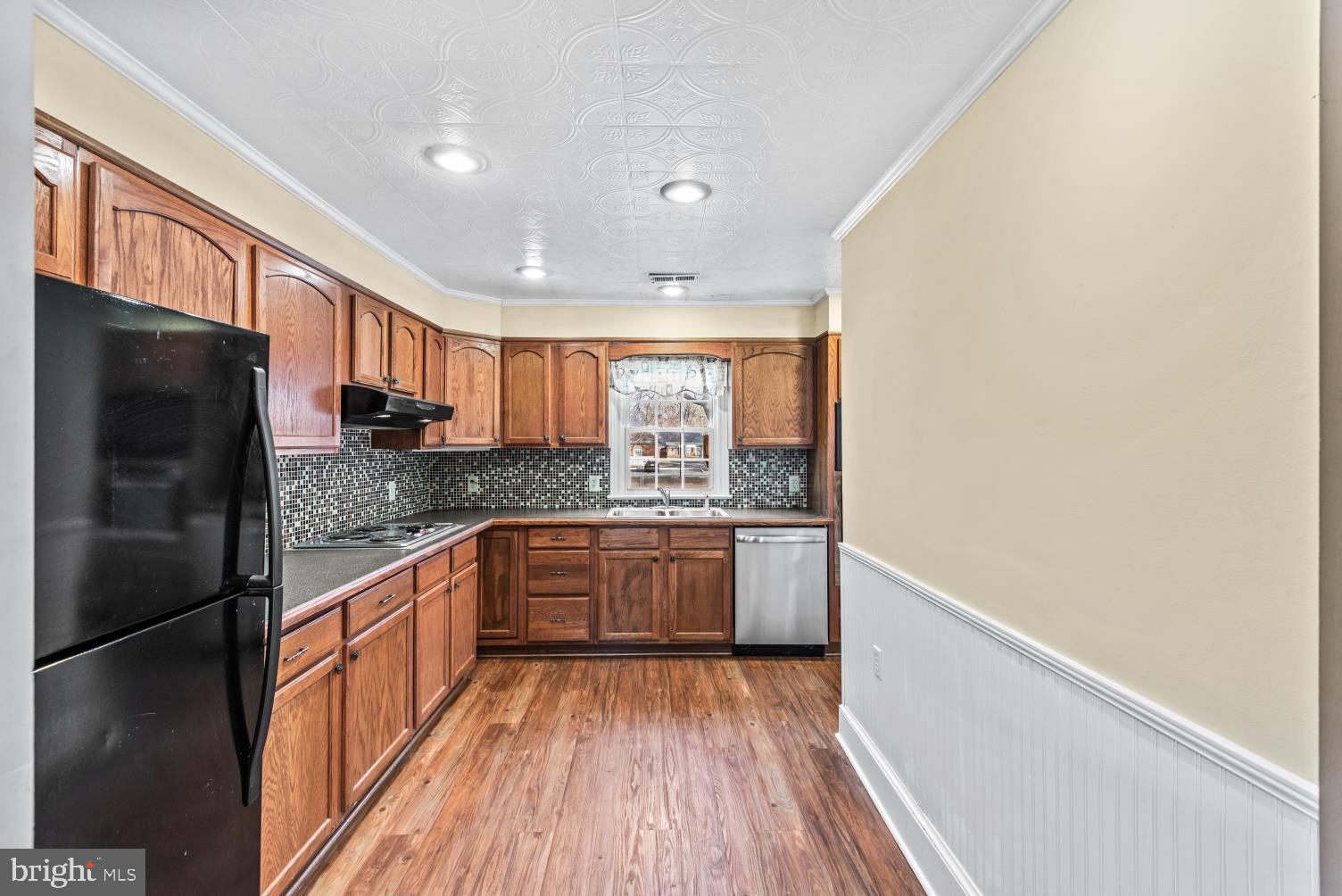149 Rectory Road Montross, VA 22520 - Photo 11 of 42 a kitchen with stainless steel appliances granite countertop a refrigerator and a stove top oven
