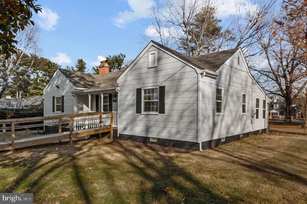 149 Rectory Road Montross, VA 22520 - Photo 3 of 42 a view of a white house with a yard and a large tree