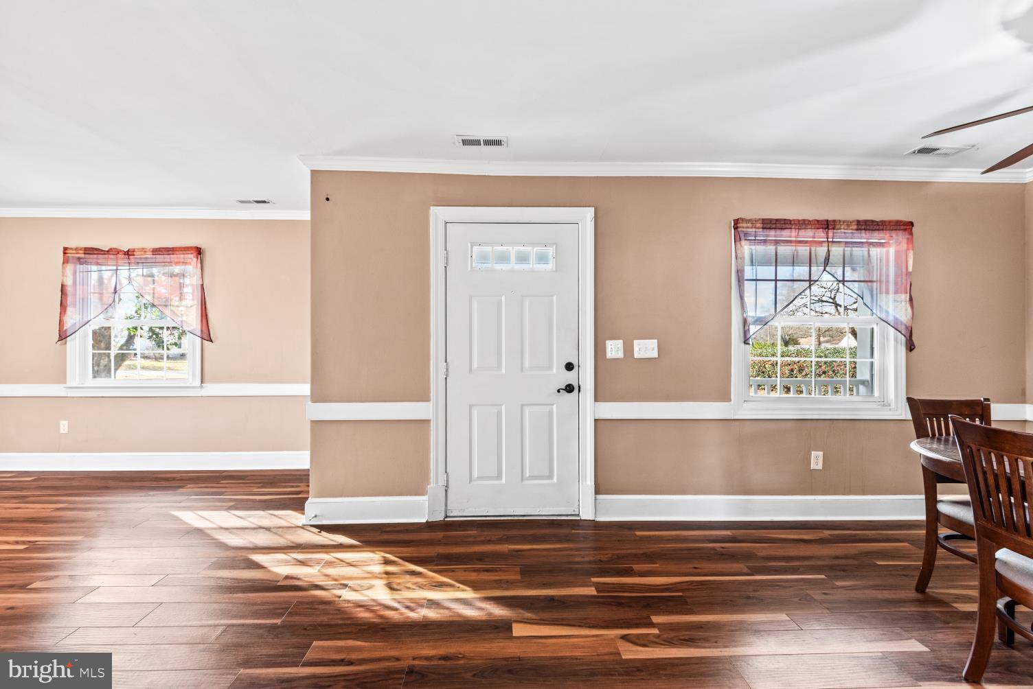 149 Rectory Road Montross, VA 22520 - Photo 6 of 42 a view of a livingroom with wooden floor and chair