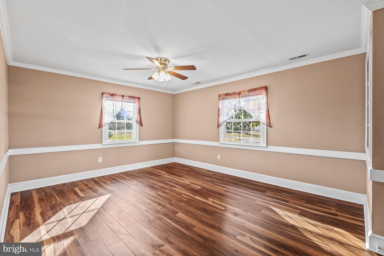 149 Rectory Road Montross, VA 22520 - Photo 7 of 42 a view of an empty room with a window and wooden floor