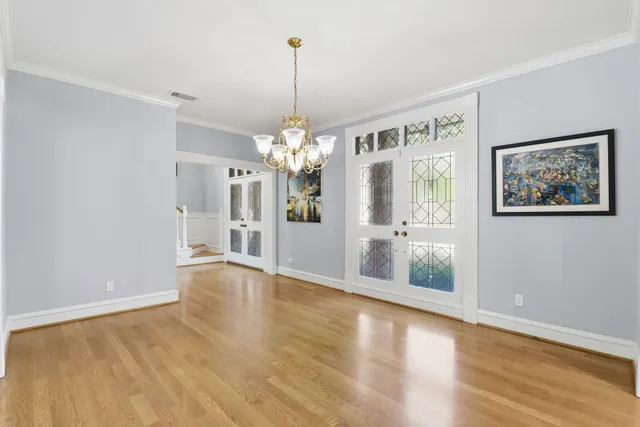 a spacious bathroom with a double vanity sink mirror double and shower