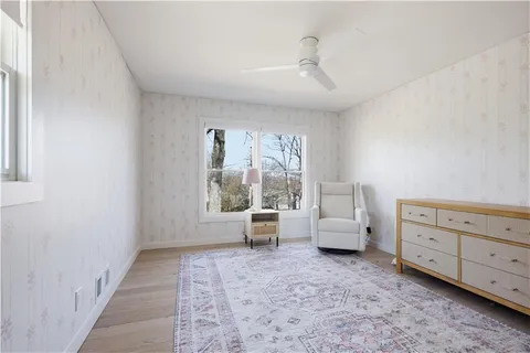 an empty room with closet and cabinet