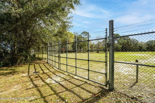 a view of a garden and basketball court