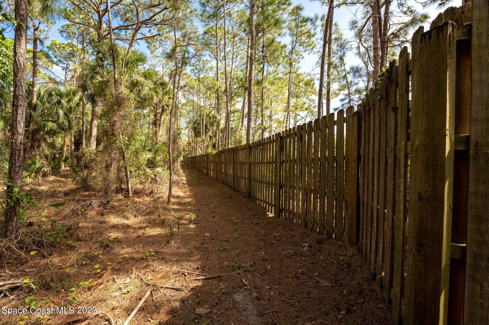 9035 Ellis Road Melbourne, FL 32904 - Photo 9 of 10 a view of outdoor space with wooden fence