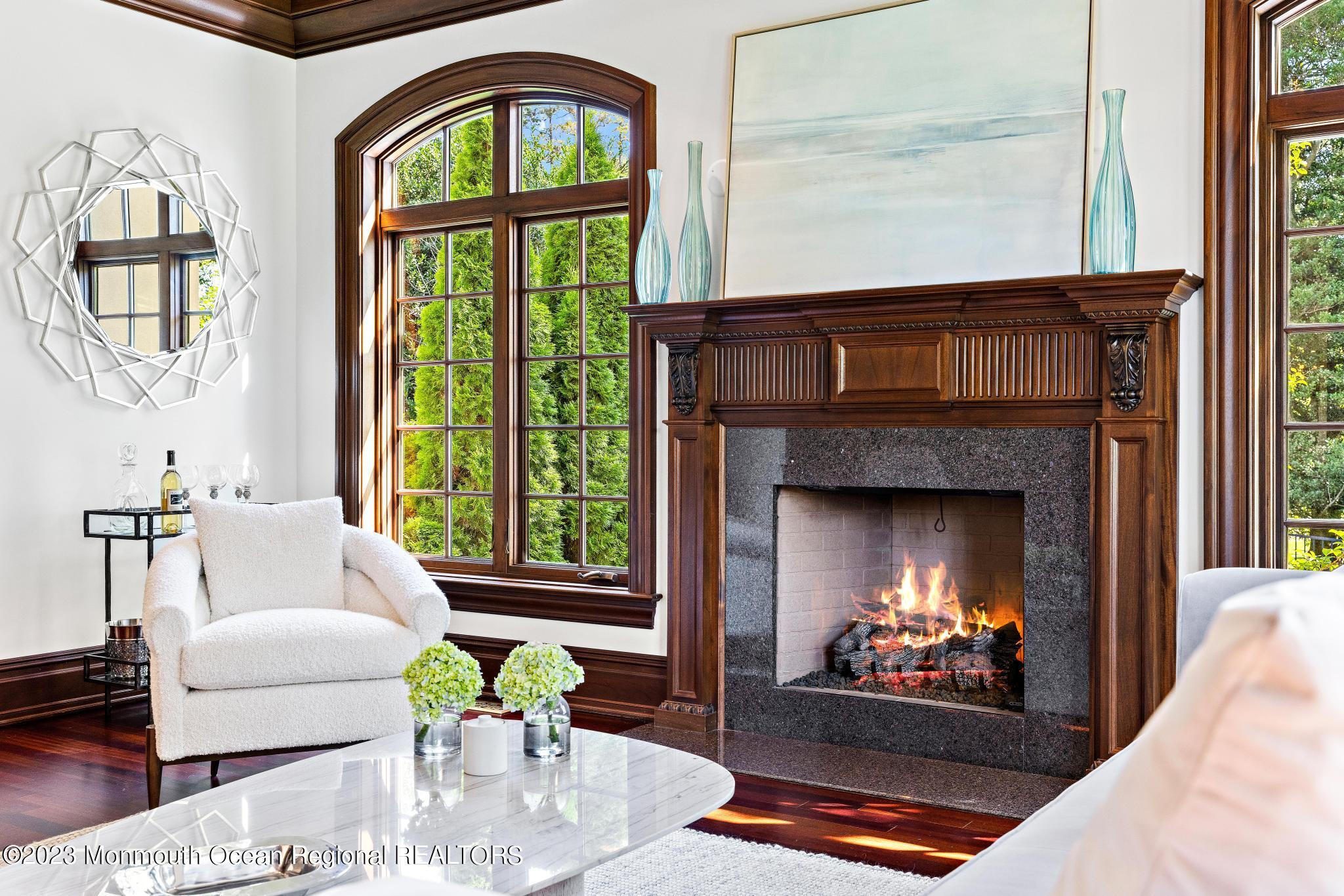 122 Rumson Road Rumson, NJ 07760 - Photo 15 of 100 a living room with furniture a fireplace and a large window