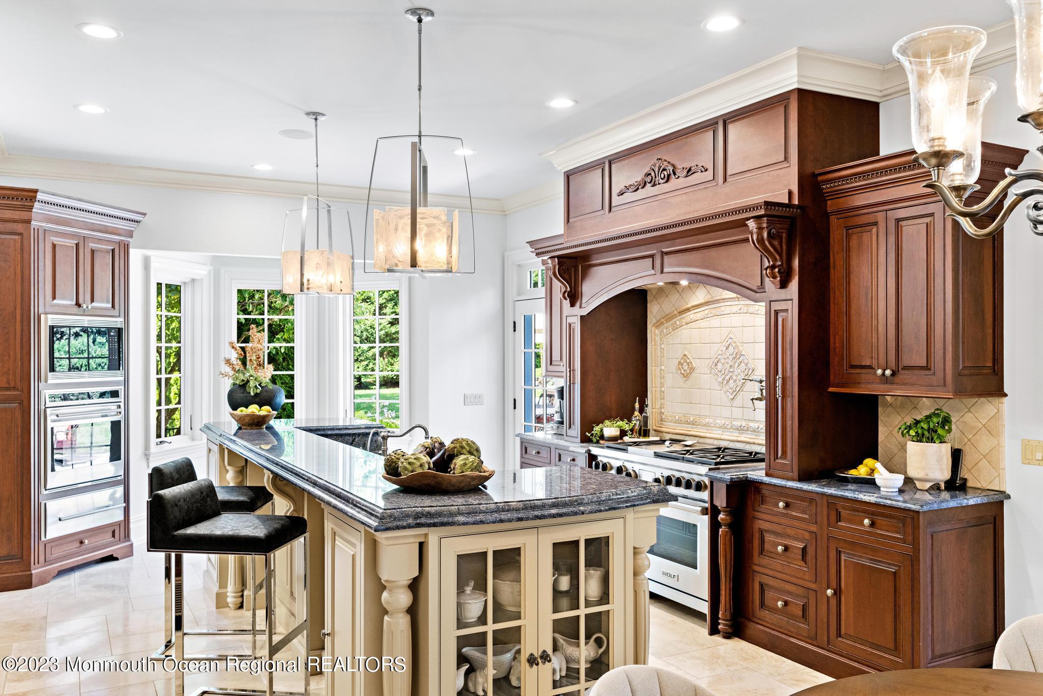 122 Rumson Road Rumson, NJ 07760 - Photo 21 of 100 a kitchen with stainless steel appliances kitchen island granite countertop a stove a sink and a cabinets