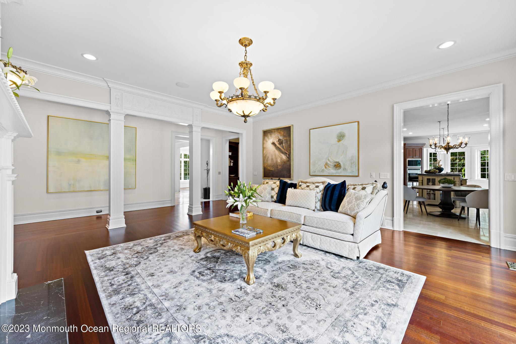 122 Rumson Road Rumson, NJ 07760 - Photo 28 of 100 a living room with furniture and a chandelier