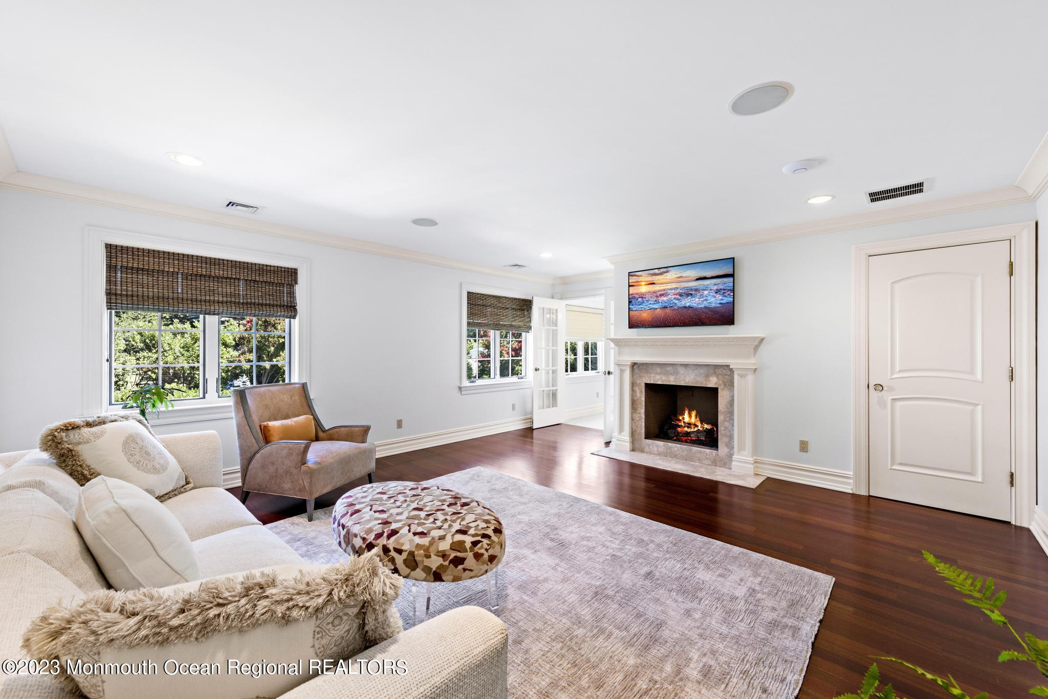 122 Rumson Road Rumson, NJ 07760 - Photo 37 of 100 a living room with furniture large window and a fireplace