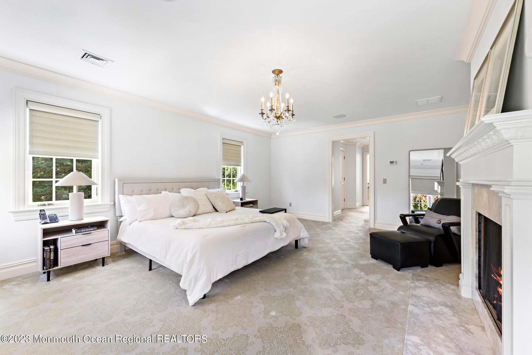 122 Rumson Road Rumson, NJ 07760 - Photo 39 of 100 a spacious bedroom with a bed and a large window