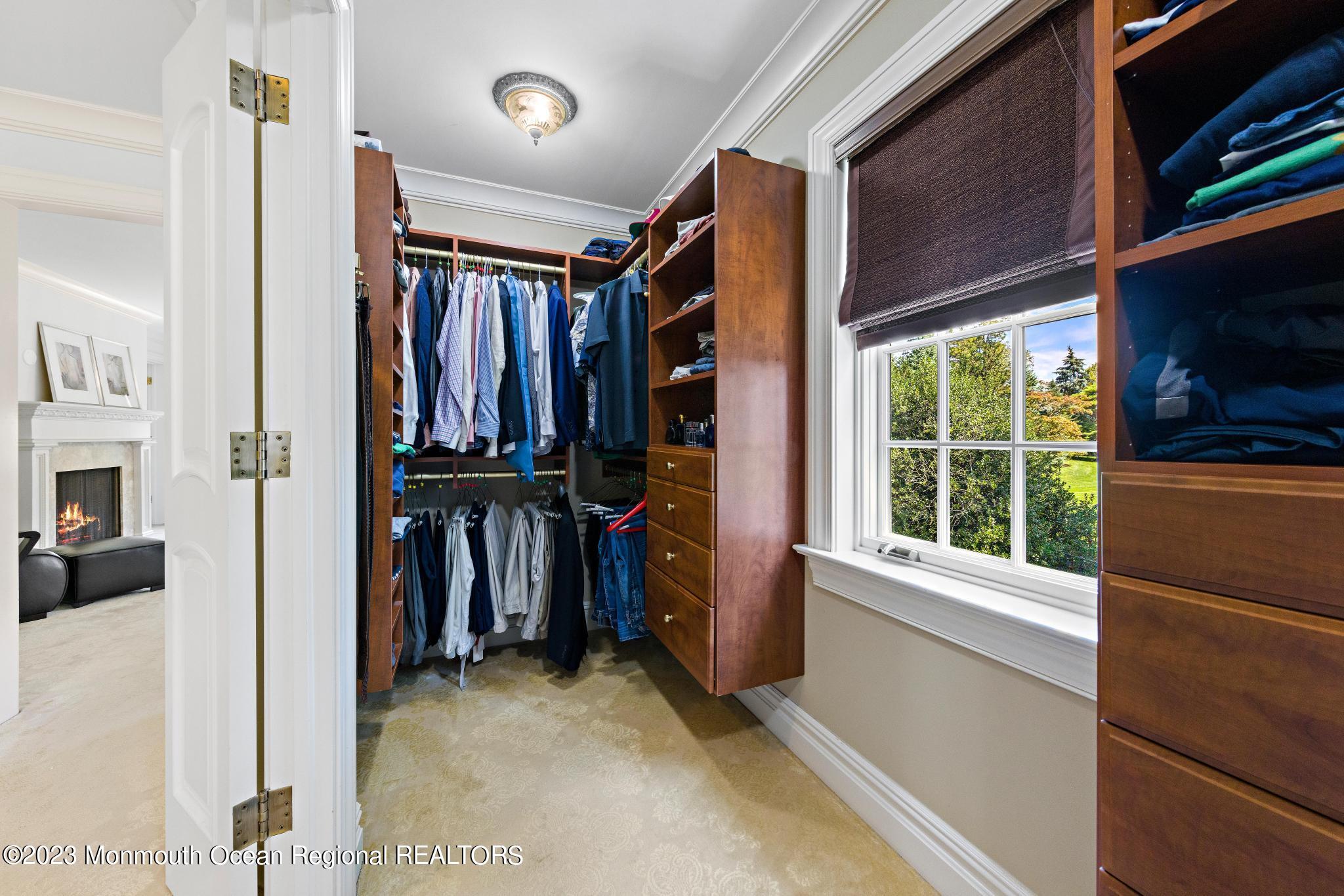122 Rumson Road Rumson, NJ 07760 - Photo 42 of 100 a view of walk in closet with clothes and shoes