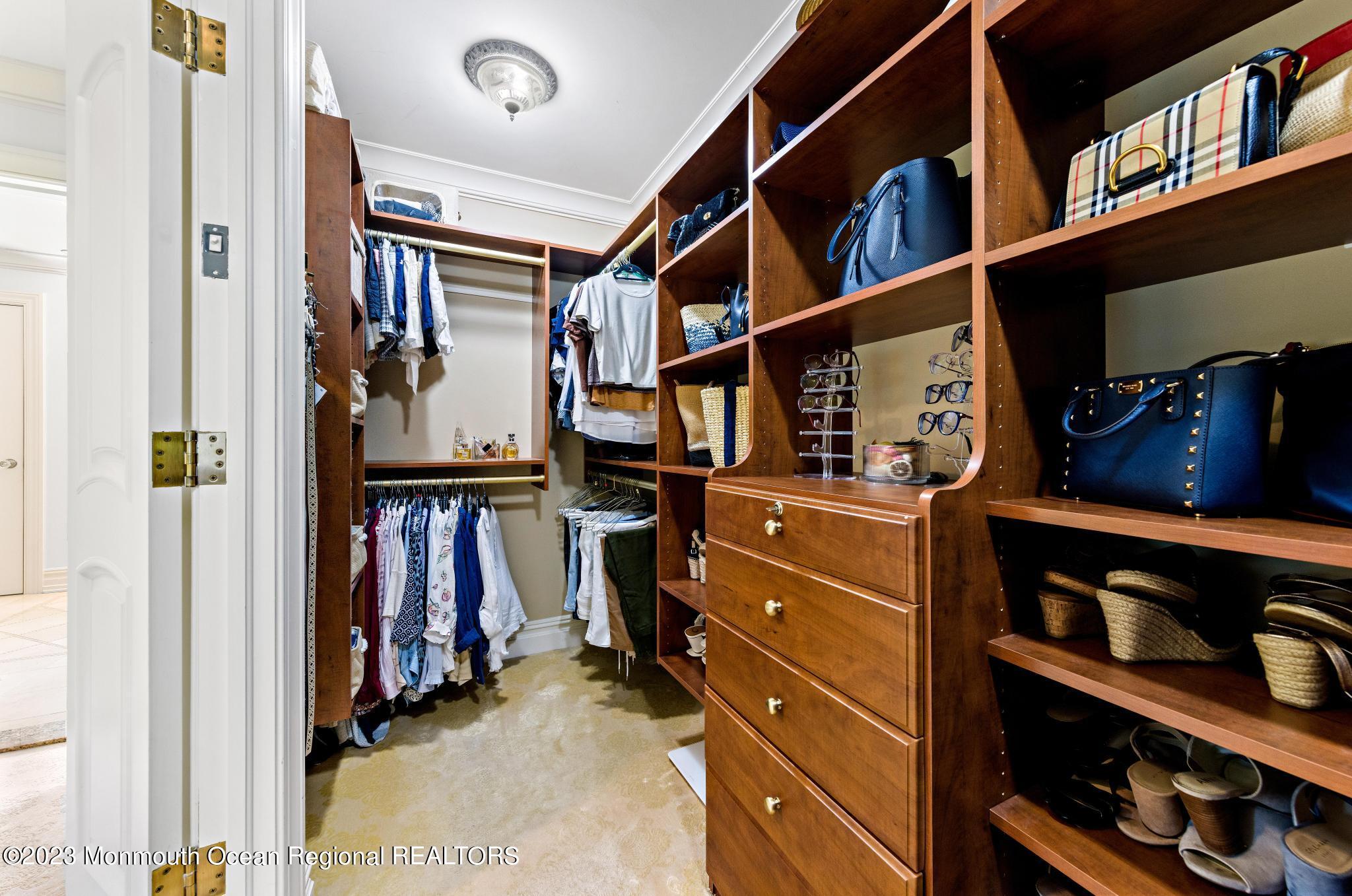122 Rumson Road Rumson, NJ 07760 - Photo 43 of 100 a view of walk in closet with clothes and shoes