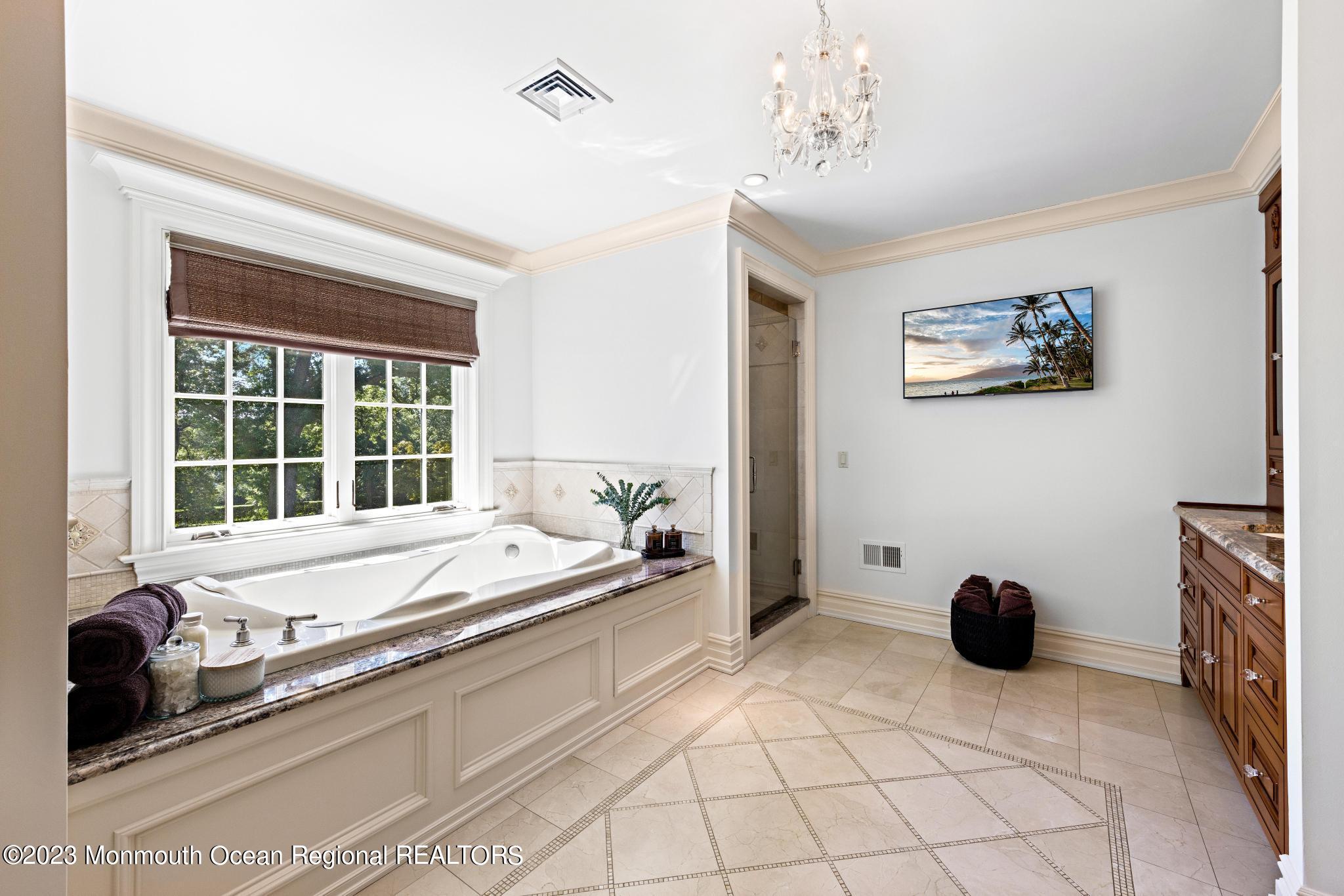 122 Rumson Road Rumson, NJ 07760 - Photo 44 of 100 a spacious bathroom with a tub a double vanity and a window