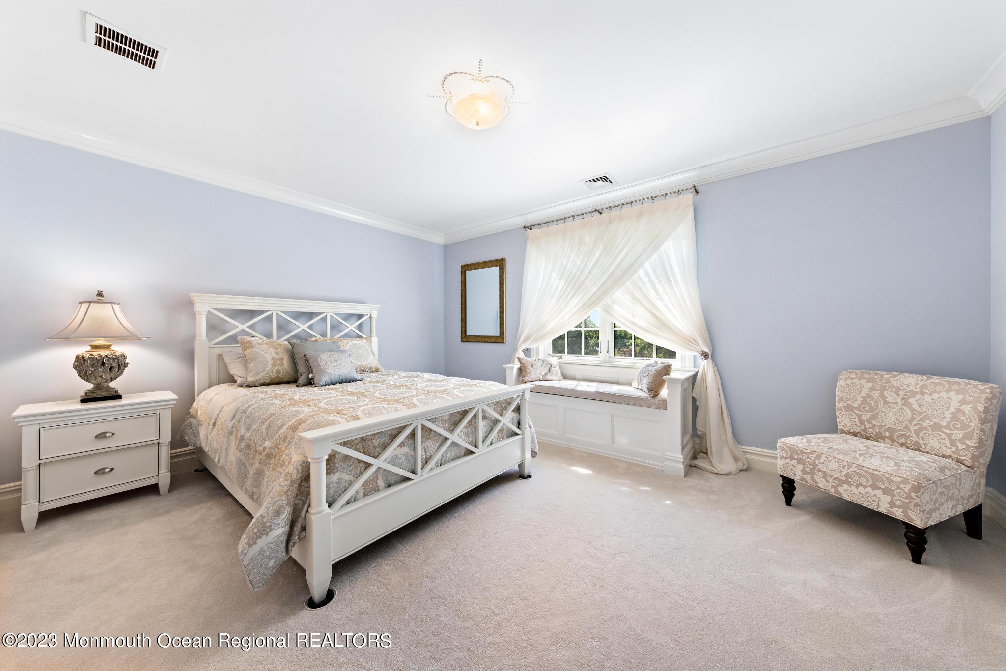 122 Rumson Road Rumson, NJ 07760 - Photo 48 of 100 a spacious bedroom with a bed and a couch