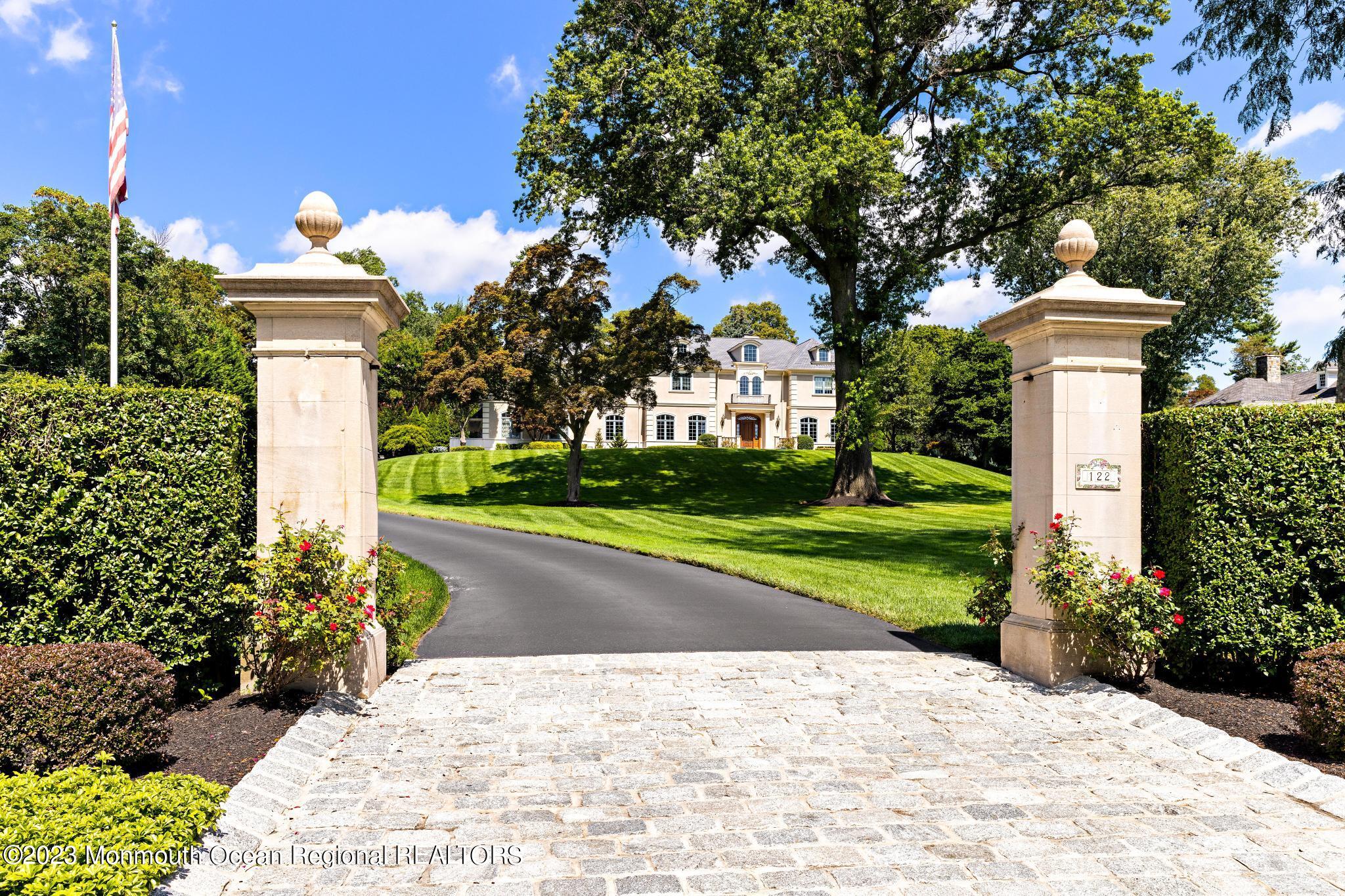 122 Rumson Road Rumson, NJ 07760 - Photo 5 of 100 a front view of a house with yard and green space