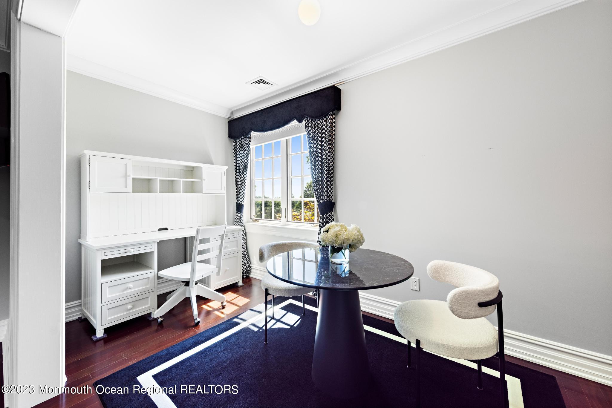 122 Rumson Road Rumson, NJ 07760 - Photo 60 of 100 a living room with furniture and a chair